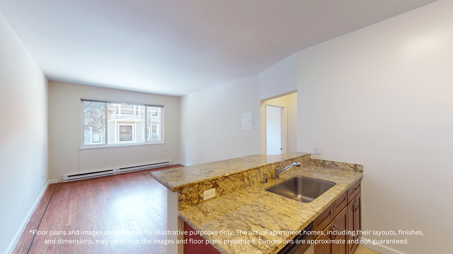 A kitchen with a granite countertop and a window.